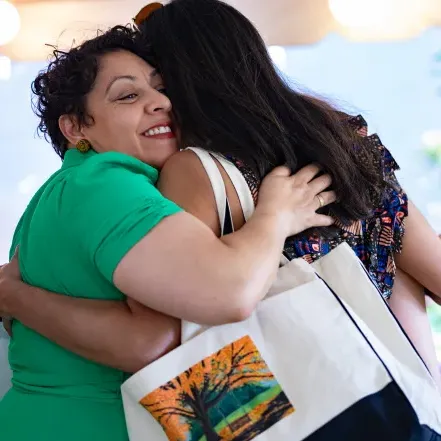 Two alums hugging at Reunion